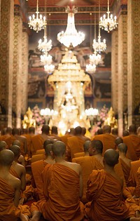 Monk praying in temple. Free public domain CC0 image.