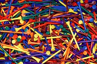 Pile of colorful golf tees. Free public domain CC0 photo.