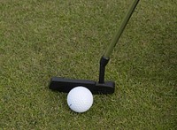 Closeup on golf club head and ball in grass. Free public domain CC0 image. 