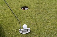 Closeup on golf club head and ball in grass. Free public domain CC0 image. 