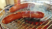 Grilling sausage. Free public domain CC0 photo.