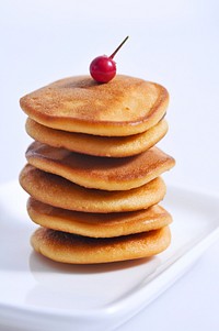 Pancake with cherry. Free public domain CC0 photo.