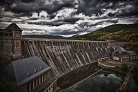 Dam with a moody cloud. Free public domain CC0 image.