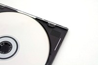 Close up of compact disc with case on white background. Free public domain CC0 photo.