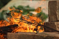 Metal on burning fire. Free public domain CC0 photo.