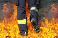 Fireman putting out fire. Free public domain CC0 photo.