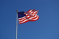 American flag waving against sky. Free public domain CC0 photo.