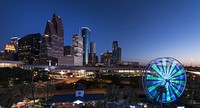 City view and ferris wheel at night. Free public domain CC0 photo.