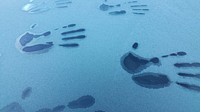 Hand prints on frosty car window. Free public domain CC0 image.