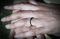 Wedding ring on finger, close up. Free public domain CC0 photo.