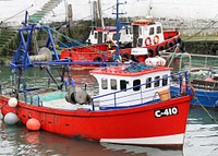 Red fishing boat at dock. Free public domain CC0 photo.