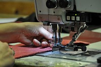 Seamstress at factory. Free public domain CC0 photo.