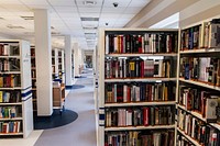 Free library shelves with many books photo, public domain CC0 image.