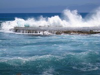 Large waves crashing into land. Free public domain CC0 image.