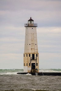 Lighthouse in middle of ocean. Free public domain CC0 image. 