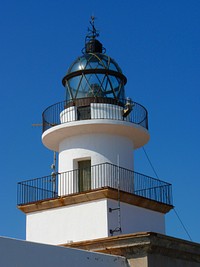 Closeup on a white lighthouse. Free public domain CC0 photo.