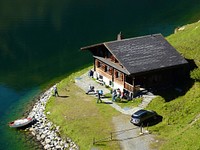 Vacation hut, Alpine lake, Switzerland. Free public domain CC0 photo.