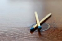 Matchstick on wooden table. Free public domain CC0 photo