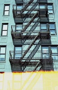 Exterior view of building with fire escape stairs in New York City, free public domain CC0 image.