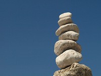 Balancing stones against sky. Free public domain CC0 photo