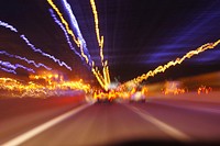 Car speeding on the road at night. 