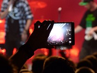 Recording concert on mobile phone. Free public domain CC0 image.