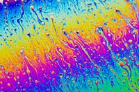 Rainbow abstract waterdrop texture. Free public domain CC0 photo.