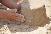 Kid playing in the sand. Free public domain CC0 photo.