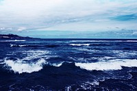 Waves crashing into beach landscape. Free public domain CC0 photo.