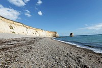 Calm waves crashing into beach. Free public domain CC0 image.