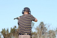 Man shooting with rifle. Free public domain CC0 photo.