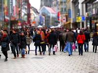 Crowded street with people wearing jacket. Free public domain CC0 image