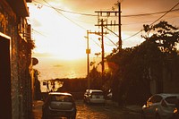 Car parked in the neighborhood at sun dawn. Free public domain CC0 photo.