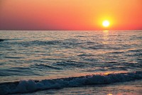Beautiful orange beach sunset. Free public domain CC0 photo.