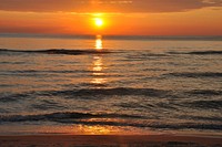 Beautiful orange beach sunset. Free public domain CC0 photo.