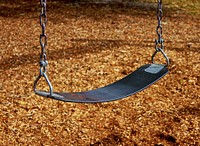 Swing in playground. Free public domain CC0 image.