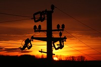 Utility pole at sunset. Free public domain CC0 image.