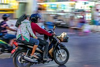 Couple on motorbike in Thailand. Free public domain CC0 photo