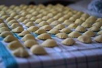 Closeup on uncooked Mezzelune pasta. Free public domain CC0 image.