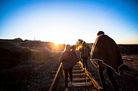 People walking on train track. Free public domain CC0 photo.