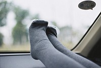 Cute feet in car window. Free public domain CC0 photo.