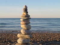 Balancing stones on beach. Free public domain CC0 photo