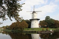 Old windmill in countryside. Free public domain CC0 photo.