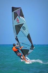 Person on Fanatic Windsurfer in ocean, location unknown, August 19, 2014. View public domain image source here