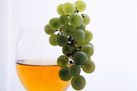 Glass of wine and green grapes. Free public domain CC0 photo.