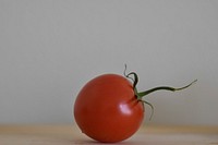 Closeup on red tomato on table. Free public domain CC0 image.