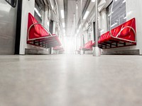 Free empty metro train with red seats public domain CC0 photo.
