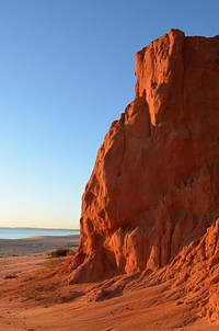 Terracotta cliff beach landscape. Free public domain CC0 image.