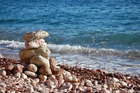 Pebble tower on the beach. Free public domain CC0 photo.