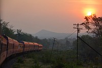 Train with sunrise. Free public domain CC0 photo.